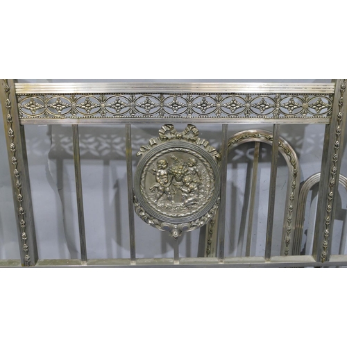 745 - A Spanish steel bedstead with centre embossed panel of cupids and allover pierced and raised shell, ... 