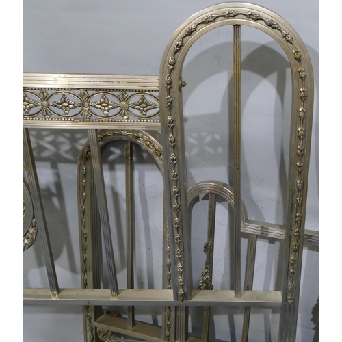 745 - A Spanish steel bedstead with centre embossed panel of cupids and allover pierced and raised shell, ... 