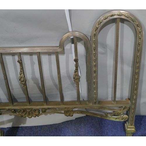 745 - A Spanish steel bedstead with centre embossed panel of cupids and allover pierced and raised shell, ... 