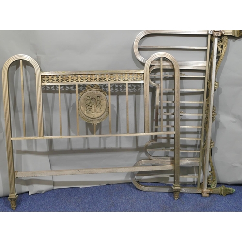 745 - A Spanish steel bedstead with centre embossed panel of cupids and allover pierced and raised shell, ... 