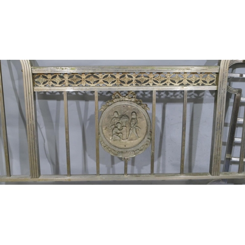 745 - A Spanish steel bedstead with centre embossed panel of cupids and allover pierced and raised shell, ... 