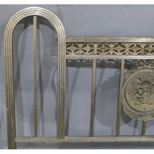 745 - A Spanish steel bedstead with centre embossed panel of cupids and allover pierced and raised shell, ... 