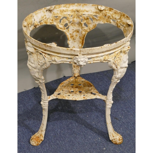 747 - A Victorian white painted cast iron garden table with 3 splayed figurehead legs with claw feet, allo... 