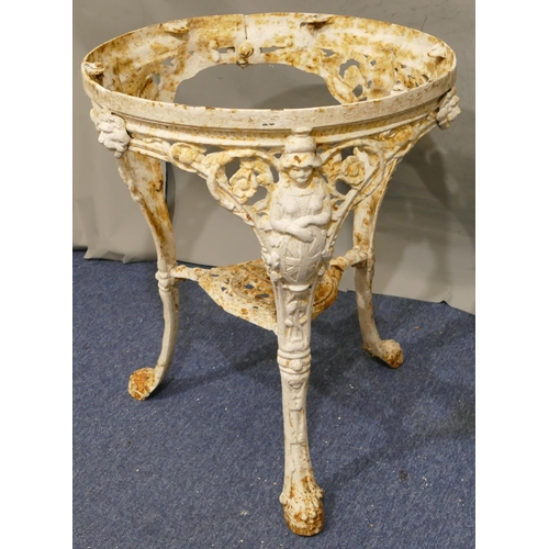 747 - A Victorian white painted cast iron garden table with 3 splayed figurehead legs with claw feet, allo... 