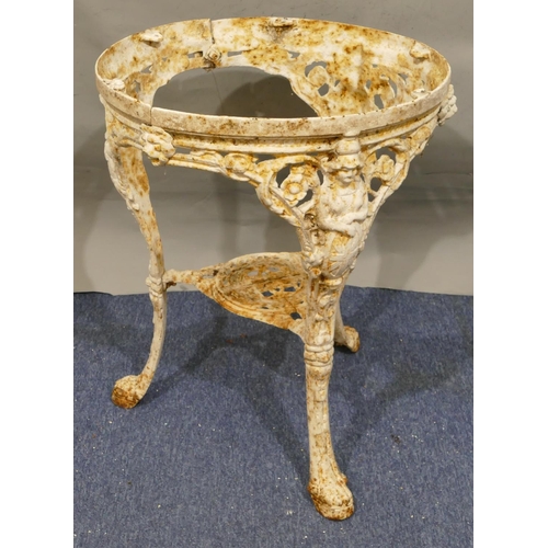 747 - A Victorian white painted cast iron garden table with 3 splayed figurehead legs with claw feet, allo... 