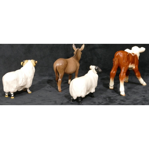 79 - A Beswick figure of a donkey, a Beswick figure of a ram, 8.5cm high, a similar figure of a sheep and... 