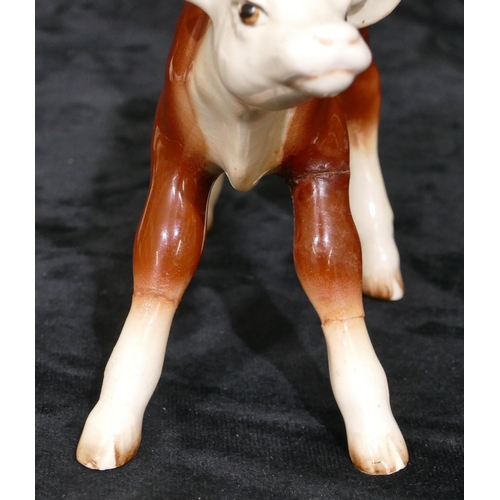 79 - A Beswick figure of a donkey, a Beswick figure of a ram, 8.5cm high, a similar figure of a sheep and... 