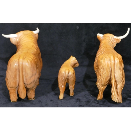 83 - A Beswick Highland bull with cow (Horn in need of restoration) and calf. (3)