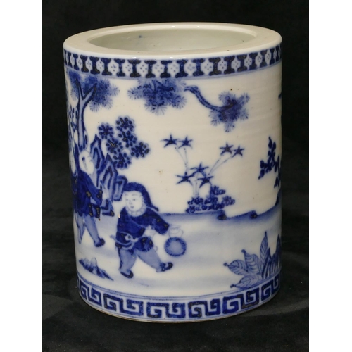 99 - An Oriental blue and white cylindrical brush pot depicting children playing in garden, 16cm high