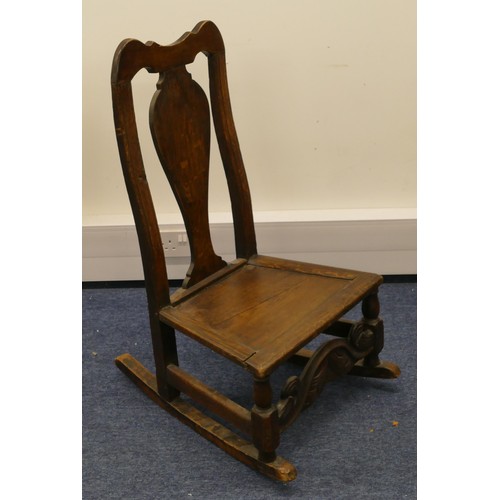 756 - An 18th century oak rocking chair, having solid seat on turned legs