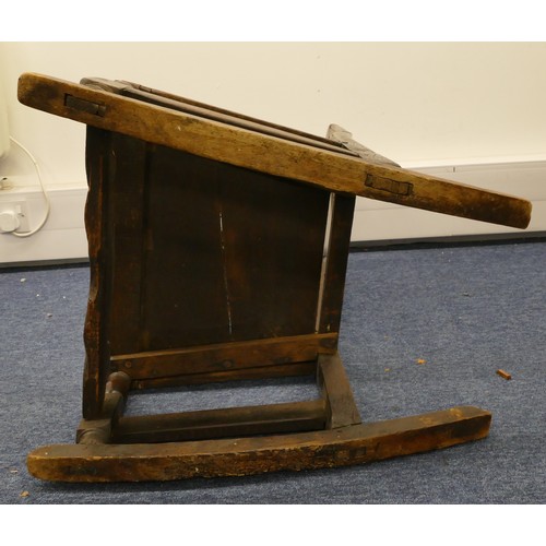 756 - An 18th century oak rocking chair, having solid seat on turned legs