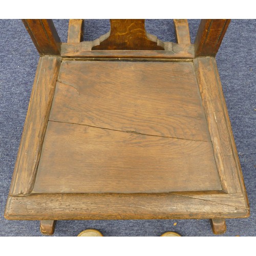 756 - An 18th century oak rocking chair, having solid seat on turned legs