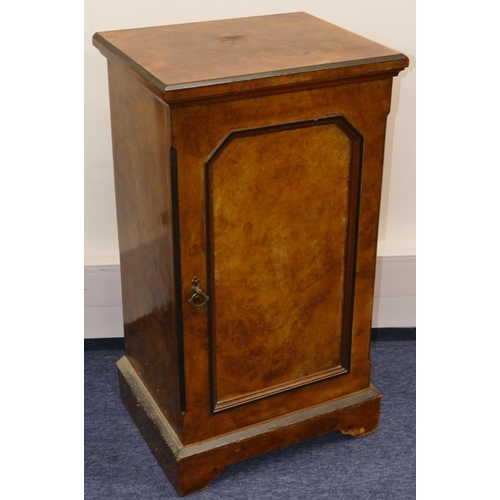 719 - A Victorian burr walnut bedside cupboard with ebonised decoration, single panel door enclosing shelf... 