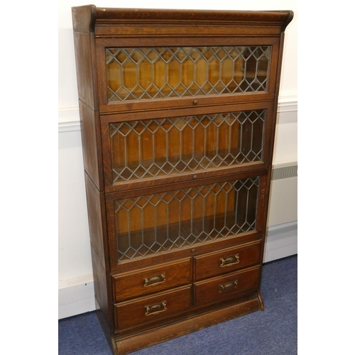 728 - An Early 20th Century oak Globe Wernicke style 4-sectioned bookcase with 3 leaded glass doors with 4... 