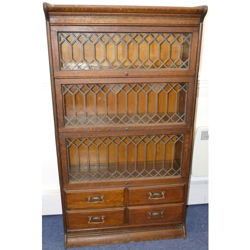 728 - An Early 20th Century oak Globe Wernicke style 4-sectioned bookcase with 3 leaded glass doors with 4... 