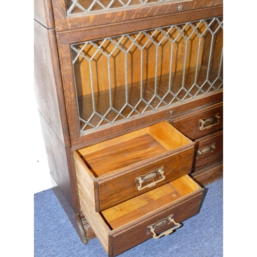 728 - An Early 20th Century oak Globe Wernicke style 4-sectioned bookcase with 3 leaded glass doors with 4... 