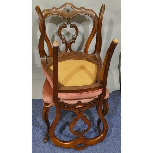 732 - A set of 6 Victorian walnut open back single chairs with pink overstuffed seats, on cabriole legs.