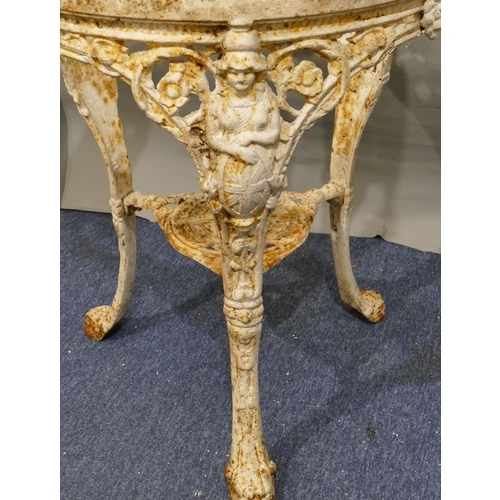 747 - A Victorian white painted cast iron garden table with 3 splayed figurehead legs with claw feet, allo... 