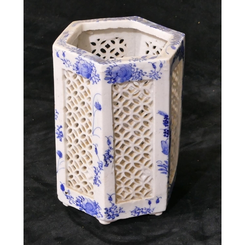 36 - An Oriental hexagonal blue and white vase with pierced and floral decoration, 17cm high.