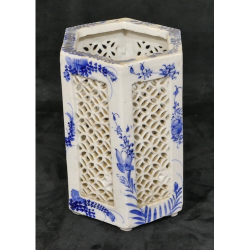 36 - An Oriental hexagonal blue and white vase with pierced and floral decoration, 17cm high.