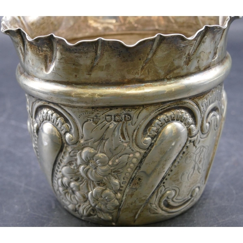 301 - A Victorian silver round trumpet shaped jardiniere with crinkled rim, embossed floral, leaf and scro... 