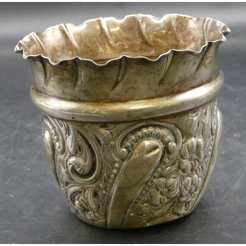 301 - A Victorian silver round trumpet shaped jardiniere with crinkled rim, embossed floral, leaf and scro... 