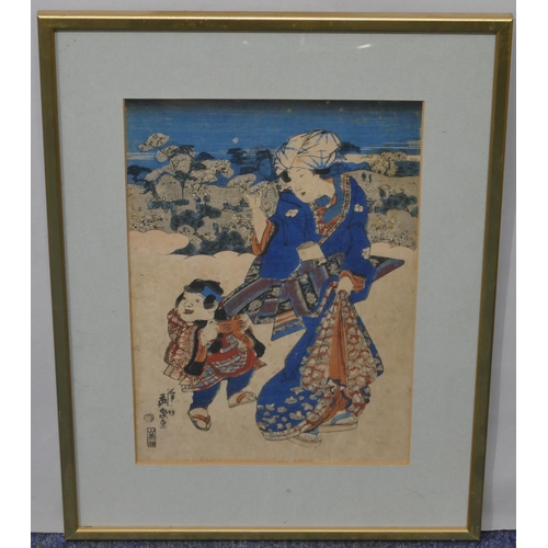 147 - A 19th Century Oriental coloured woodblock print depicting standing lady and child, signed, in gilt ... 