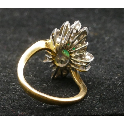 500 - A high carat yellow gold cluster ring set with centre emerald and surrounded by small diamonds, size... 