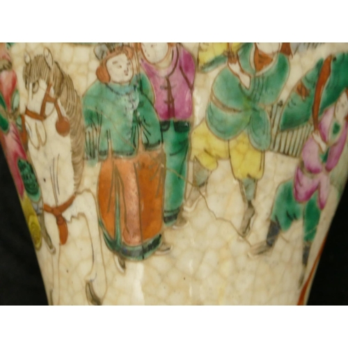 29 - An Oriental round bulbous thin necked trumpet shaped crackleware vase with multi-coloured warrior de... 