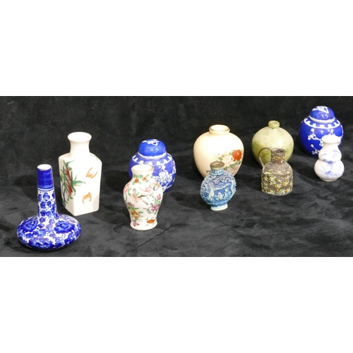 78 - A Cantonese miniature small round bulbous thin necked vase on white ground with multi-coloured butte... 