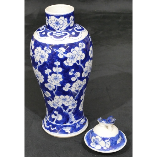 13 - An Oriental 19th Century blue and white round bulbous thin necked lidded vase with branch and blosso... 