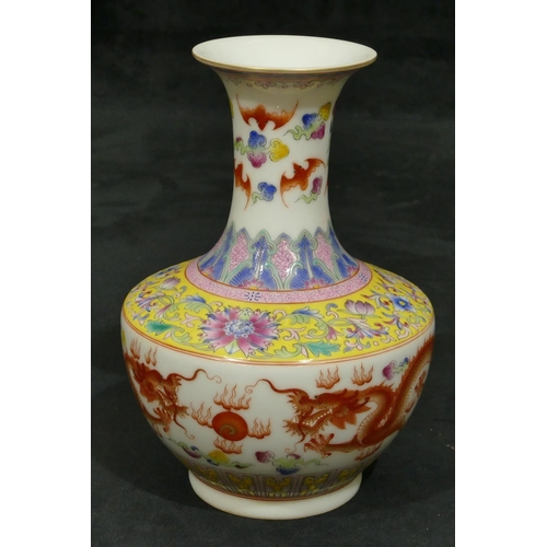 140 - An Oriental round bulbous thin necked trumpet shaped vase on white ground with multi-coloured dragon... 