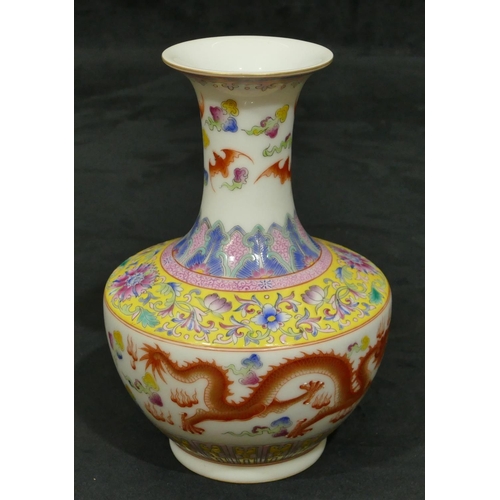 140 - An Oriental round bulbous thin necked trumpet shaped vase on white ground with multi-coloured dragon... 