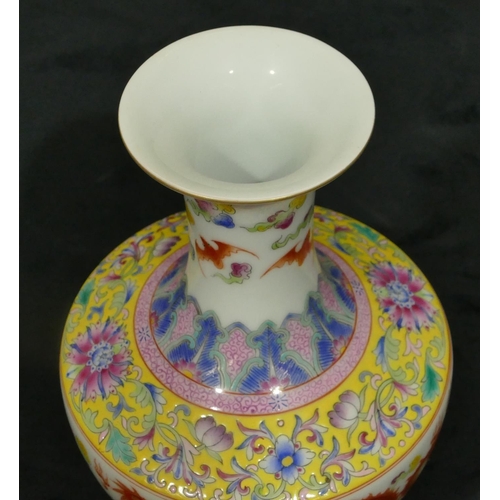 140 - An Oriental round bulbous thin necked trumpet shaped vase on white ground with multi-coloured dragon... 