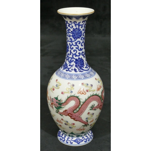 141 - An Oriental round bulbous thin necked trumpet shaped vase on white and blue ground with multi-colour... 