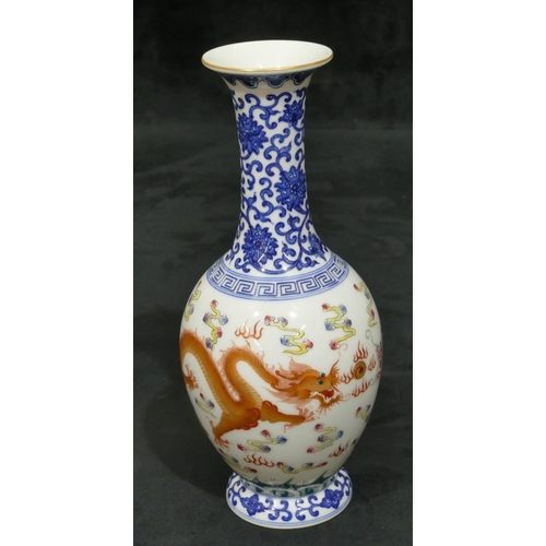 141 - An Oriental round bulbous thin necked trumpet shaped vase on white and blue ground with multi-colour... 