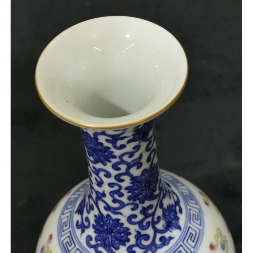 141 - An Oriental round bulbous thin necked trumpet shaped vase on white and blue ground with multi-colour... 