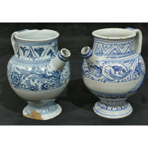 144 - 2 18th Century Delft apothecary jugs on blue and white ground with allover floral and leaf decoratio... 