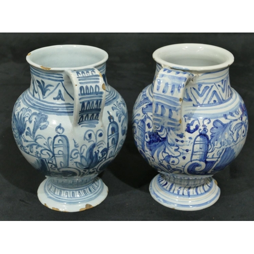 144 - 2 18th Century Delft apothecary jugs on blue and white ground with allover floral and leaf decoratio... 