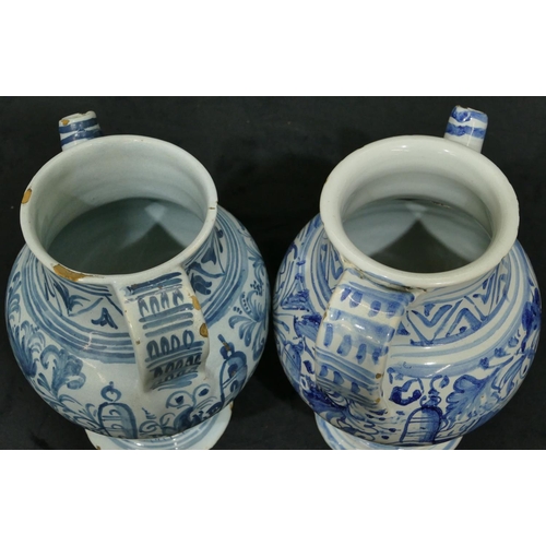 144 - 2 18th Century Delft apothecary jugs on blue and white ground with allover floral and leaf decoratio... 