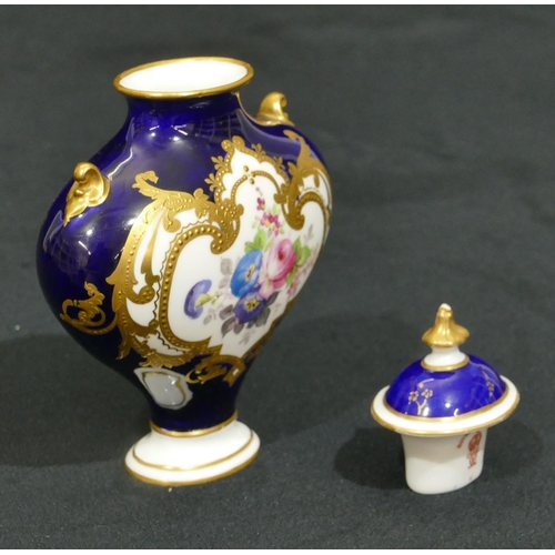 146 - A Royal Crown Derby miniature bulbous thin necked 2-handled lidded vase on Royal blue ground and han... 