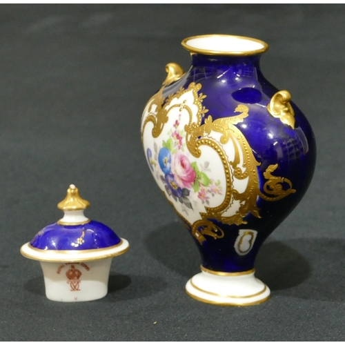 146 - A Royal Crown Derby miniature bulbous thin necked 2-handled lidded vase on Royal blue ground and han... 