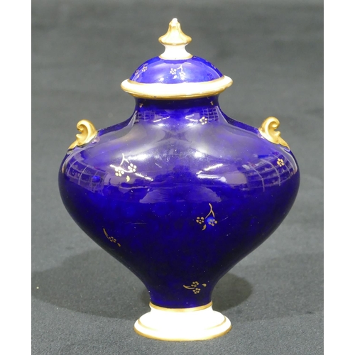 146 - A Royal Crown Derby miniature bulbous thin necked 2-handled lidded vase on Royal blue ground and han... 