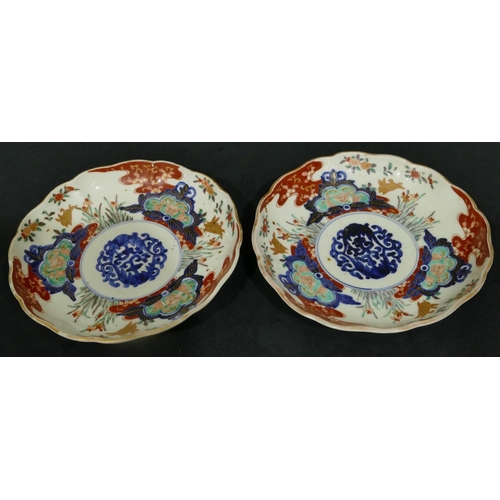 149 - A pair of 19/20th Century Imari round scallop shaped plates on white, red and blue ground with colou... 