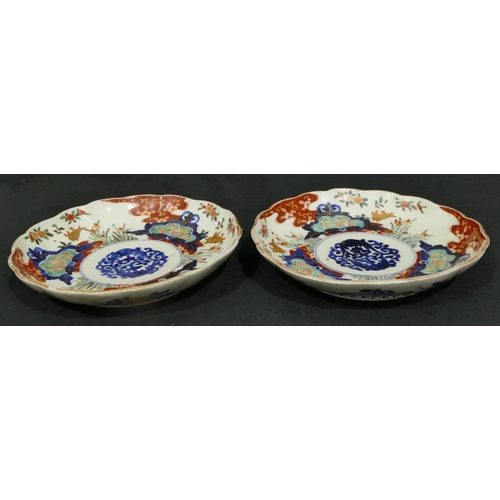 149 - A pair of 19/20th Century Imari round scallop shaped plates on white, red and blue ground with colou... 