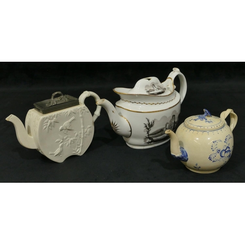 150 - A Creamware round bulbous shaped teapot with blue fruit and leaf decoration, twist handle, 12cm high... 