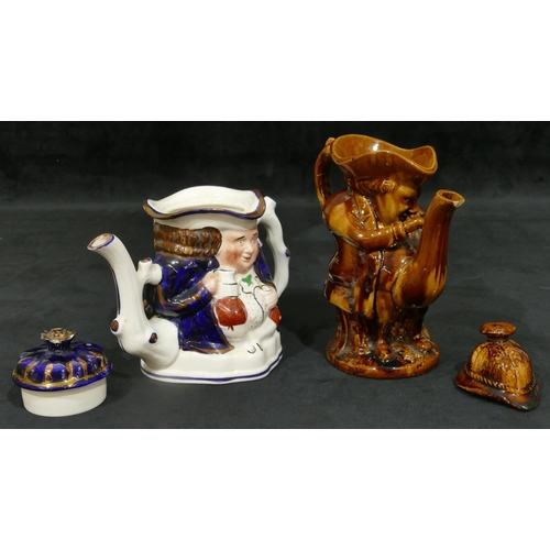 152 - A 19th Century Treacle Ware Staffordshire teapot with cover in form of a standing gentleman, 25.5cm ... 