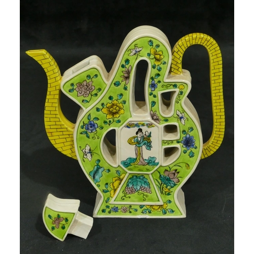 154 - An Oriental teapot, scallop shaped on yellow and pale green ground with multi-coloured Oriental figu... 