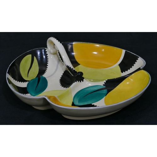 16 - A Susie Cooper Art Deco 3-sectioned dish with scroll handle on white, black, yellow and turquoise gr... 
