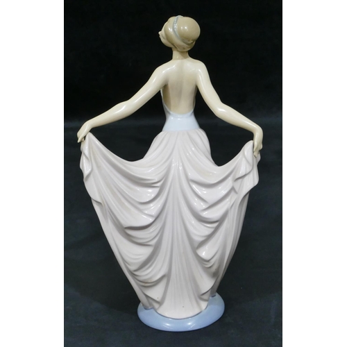 41 - A Lladro figure of a lady in evening gown on round base, 30.5cm high